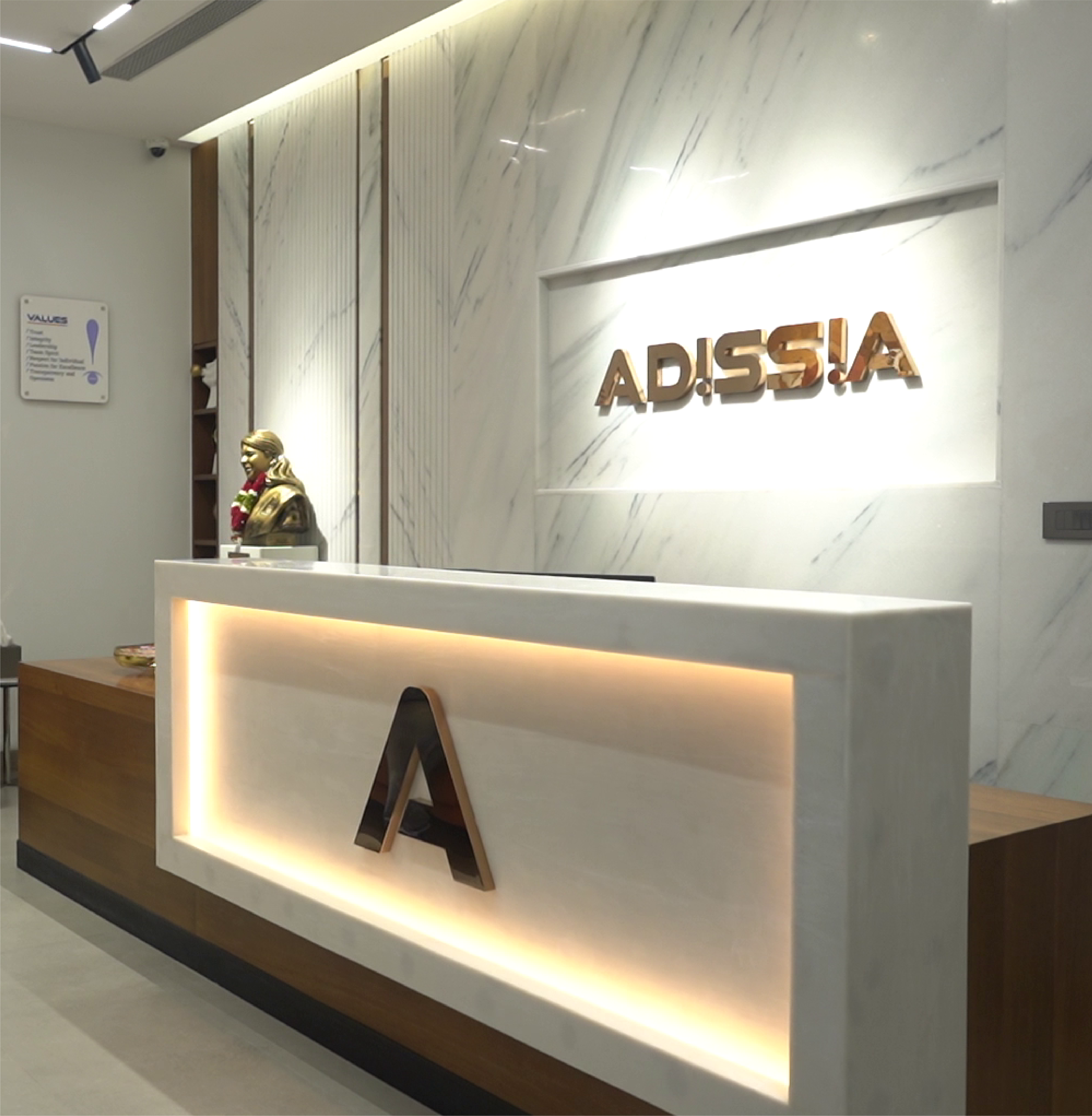 A welcome area for the top property dealing & real estate company, featuring a blue & white counter.